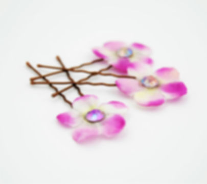 pink and white fabric flower hair pins