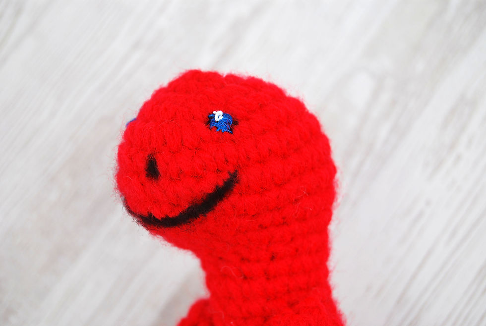 Thumbnail: Red dinosaur stuffy, red crochet dino plush