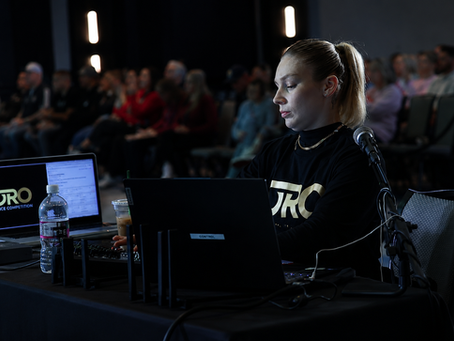 Oro judge reviewing performances during a live dance competition