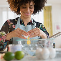Woman cracking egg