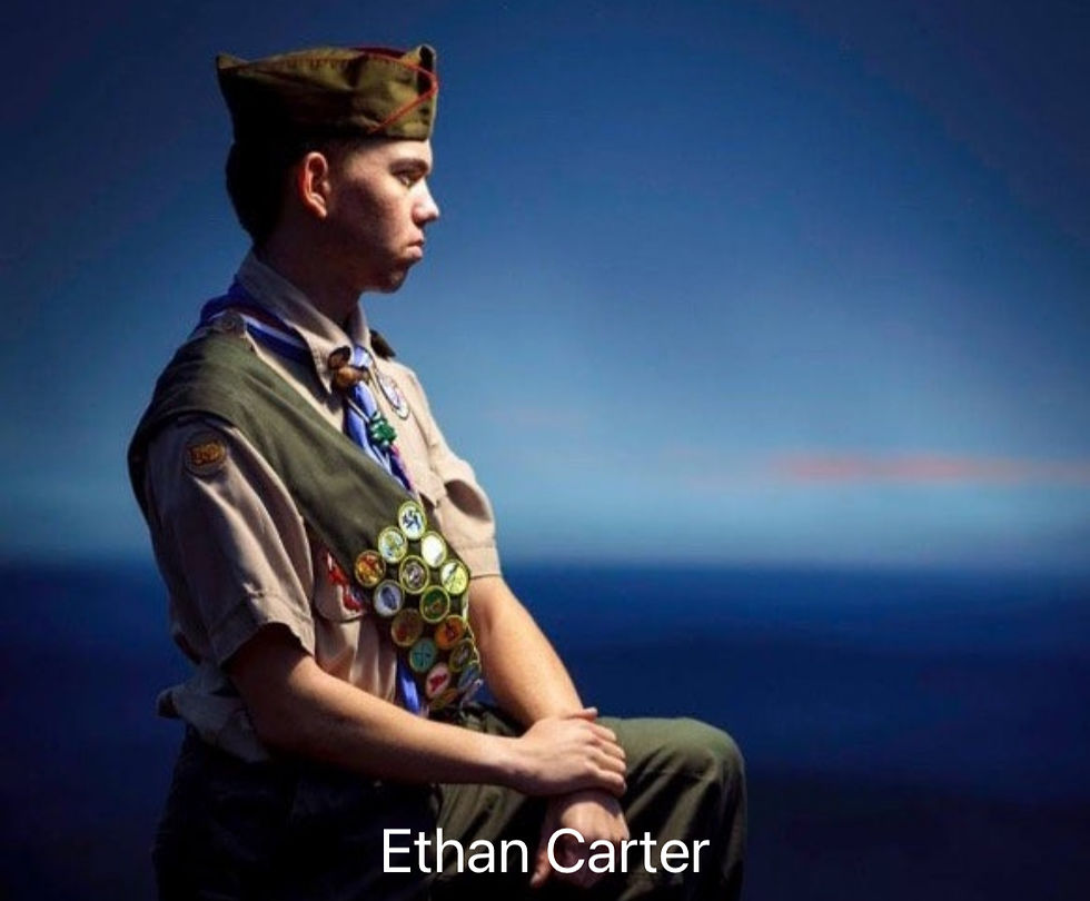 Ethan Carter in scout uniform with badges