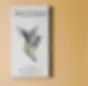 Sol Cacao Colombia Chocolate Bar White Packaging with 3 Green and Purple Hummingbirds on it