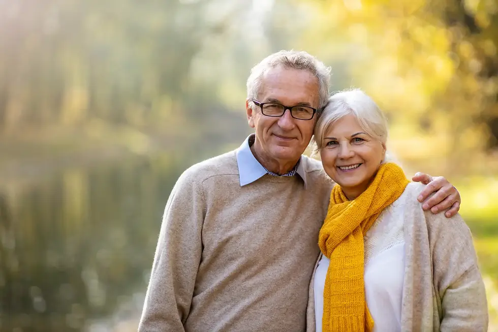 Happy older couple outdoors, representing peace of mind after a financial capacity assessment
