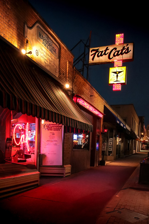 Nighttime Neon Cafe Photo — Urban Street Photography with Martini Sign