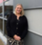 Lisa Smith, Operations Director at DM & Co, standing outside the Solihull office