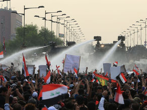 Protesters rise again in Iraq, street blockades, burning tires, clamoring for an end to sectarianism