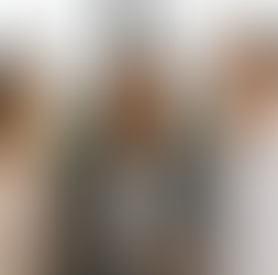 Young Asian woman professional with the traditional Asian parents in front of a window with a view of a large city in the distance