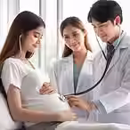 Pregnant woman smiles as a doctor uses a stethoscope on her belly. Another doctor observes, both in white coats, in a bright room.