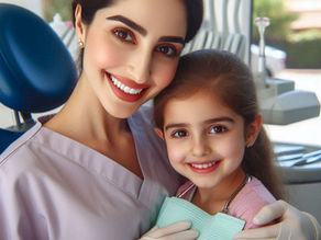Dentist and child smiling at camera in dental office. The dentist is in a light purple uniform, and the child wears a stethoscope.