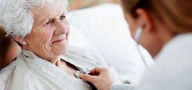 a nurse practitioner checking a patient's blood pressure