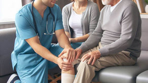 Hospice FNP Nurse sits with patent and family in hospital waiting room or chapel