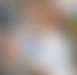 orthodontist in white lab coat holding dental model