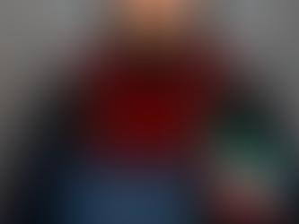 woman graduating from advanced education PhD program holding Kuwaiti flag