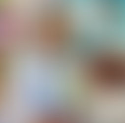 Smiling dentist with a masked face interacts with a happy child in a colorful dental clinic, featuring playful tooth-themed decor.