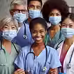 A diverse group of six healthcare professionals in masks and scrubs smile confidently. Background is neutral, emphasizing teamwork and unity.