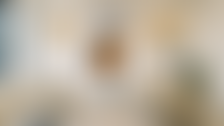 spacious and well lit multilingual dental clinic with words featured on one wall along with a depiction of a dental professional