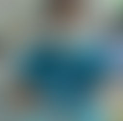 Dentist in blue scrubs with instruments