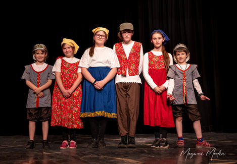 Young actors in period costumes