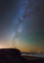 Starry skies image by photographer Alyn Wallace. man raising his arms above his head silhouetted against the night sky filled with stars