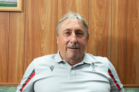Headshot of a man wearing a Wales rugby shirt