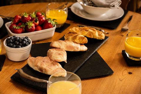Delicious croissants and fresh fruit breakfast