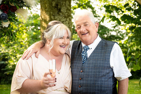 Happy bride and father, champagne toast