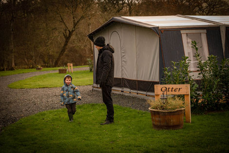 Boy and dad at Otter caravan pitch