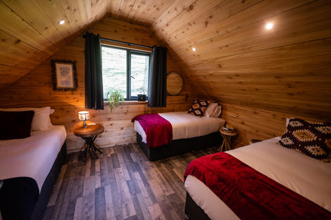 Cosy attic bedroom with three single beds