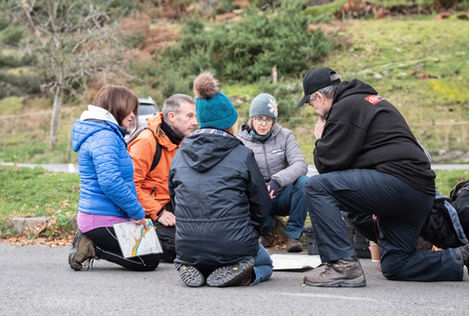 Hikers reviewing map outdoors