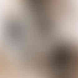 A newly postpartum mom walks back into her house after giving birth in the car. Her midwife is next to her, helping her hold a large disposable pad between her legs