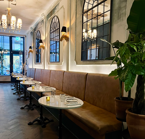 Eclectic interior of Frame Notting Hill as a Parisian brasserie meets Mediterranean warmth 