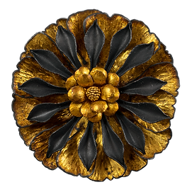 A flower shaped brooch with broad gold overlay petals, oxidized silver petals, and 22 karat gold granulation