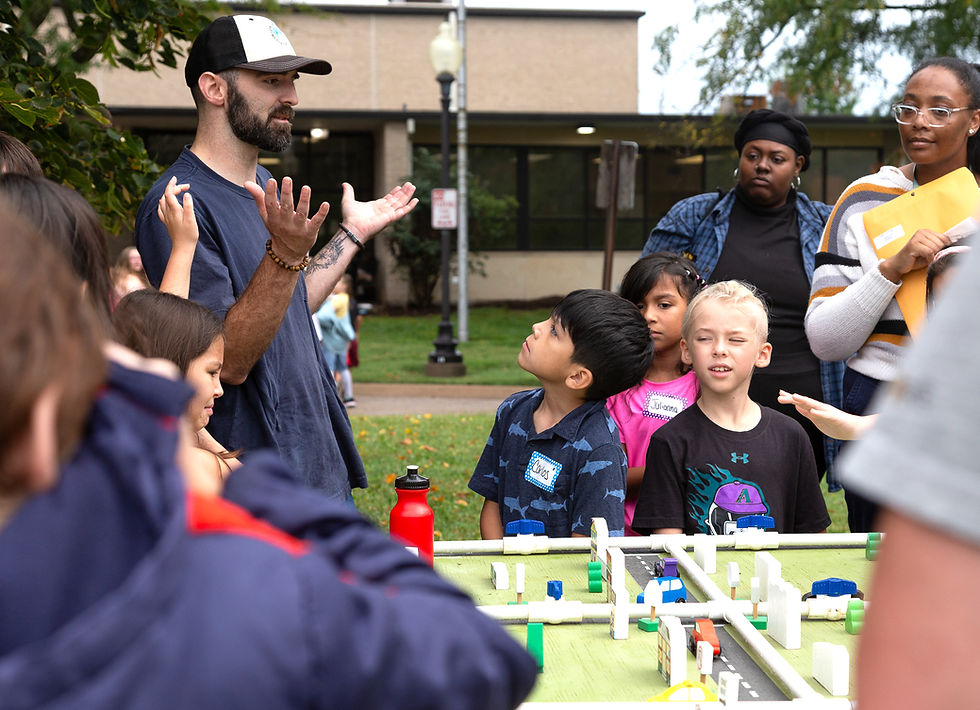 a child listening to a facilitator talk