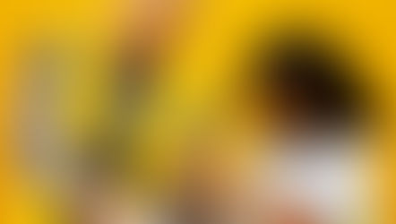 A woman and a child doing a project with their hands