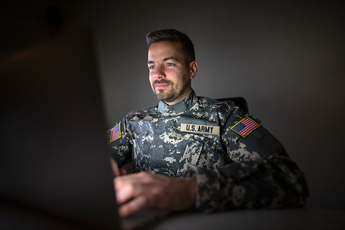 american-soldier-military-uniform-with-usa-patch-flags-working-late-computer.jpg