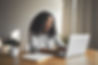 gorgeous-positive-young-dark-skinned-female-blogger-keyboarding-generic-laptop-smiling-bei