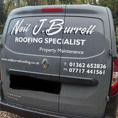 A grey van features white lettering promoting Neil J. Burrell, a roofing specialist in property maintenance