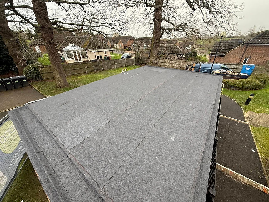 A flat roof with a parked car on top, showcasing an unconventional use of rooftop space
