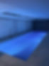 Indoor swimming pool with blue lighting