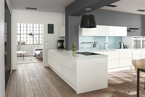 Kitchen with white cabinets and an island under a sleek black pendant light