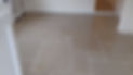 Smooth, light grey tiled floor in a living area