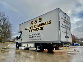 Removal truck with business signage