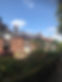 Well-maintained care home exterior with brick buildings and landscaped surroundings