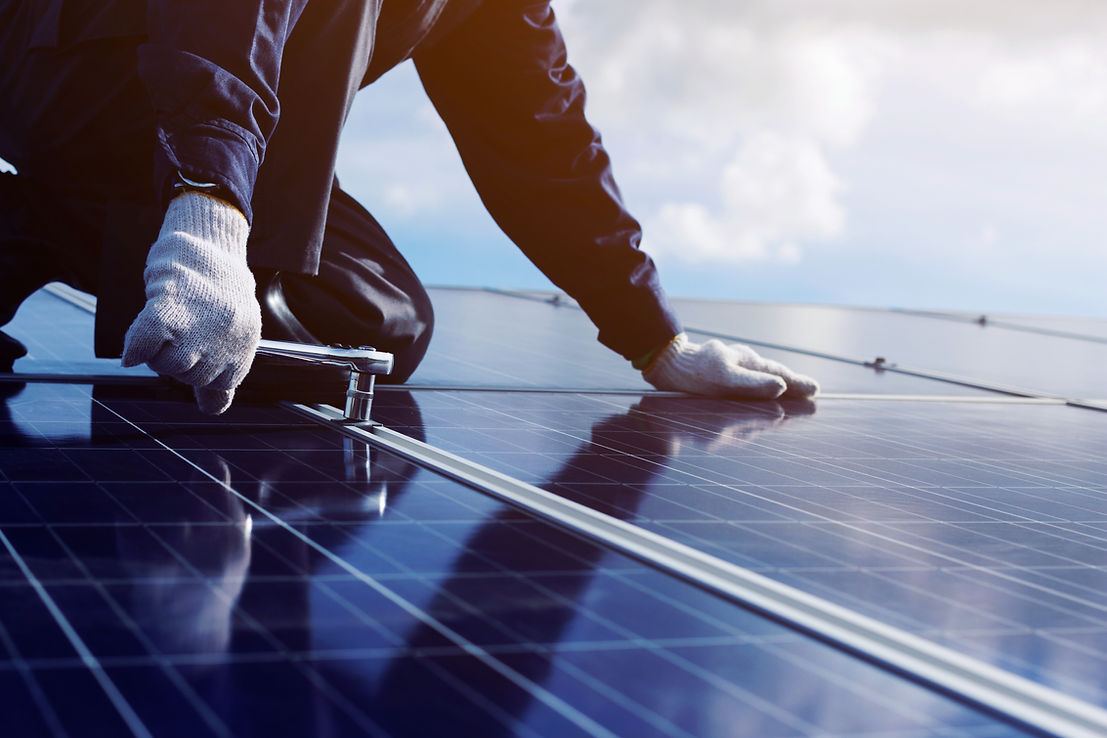 Engineers servicing solar energy plant