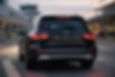 Black Mercedes SUV parked at an airport. Text on the rear reads, "It's Not a Taxi