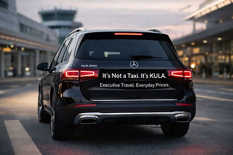 Black Mercedes SUV parked at an airport. Text on the rear reads, "It's Not a Taxi