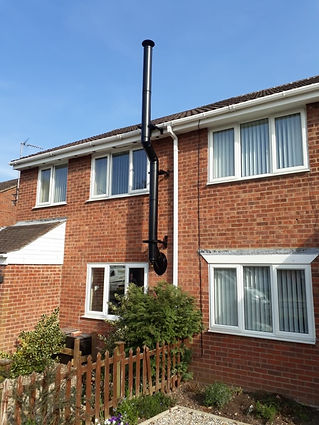 Brick house exterior with chimney pipe