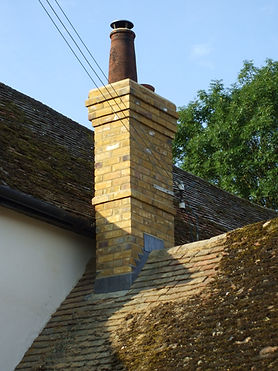 Brick chimney with a single clay pot