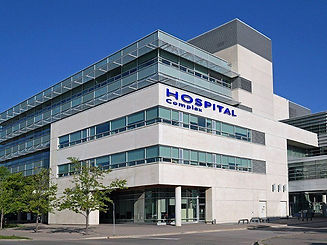 Modern hospital building with large glass windows and a minimalist design