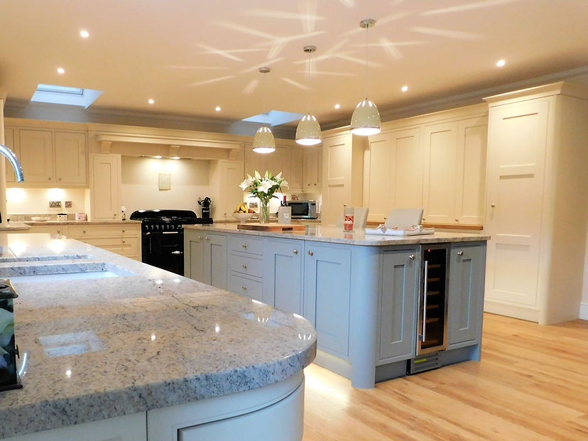 Kitchen with large light blue cabinets, granite countertops, and pendant lighting